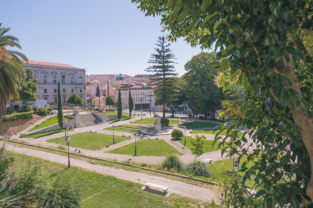 a view of a park with a fountain in the middle