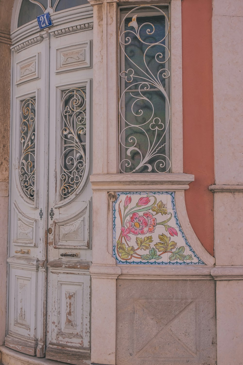a white door with a floral design on it