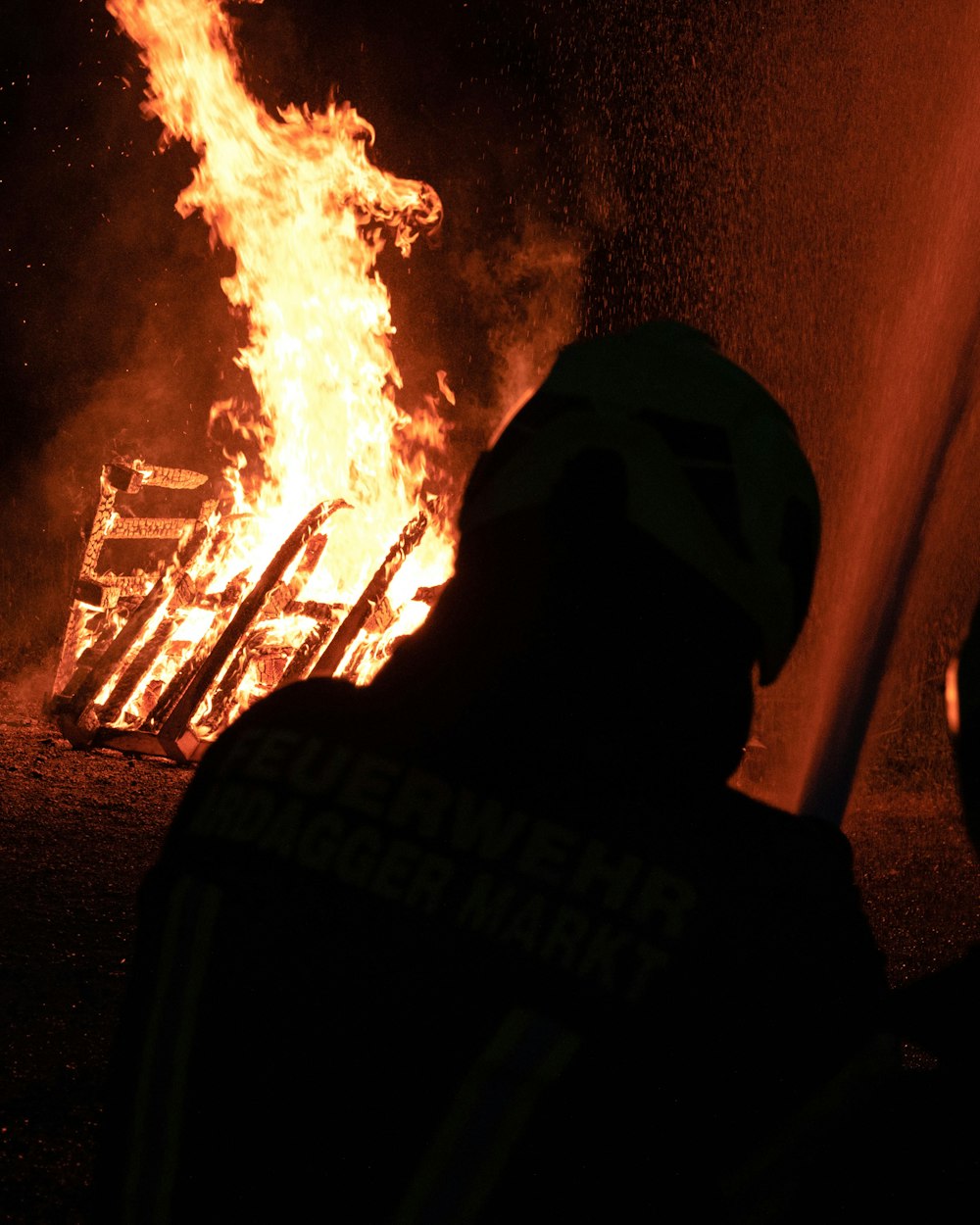 a man standing in front of a fire hydrant