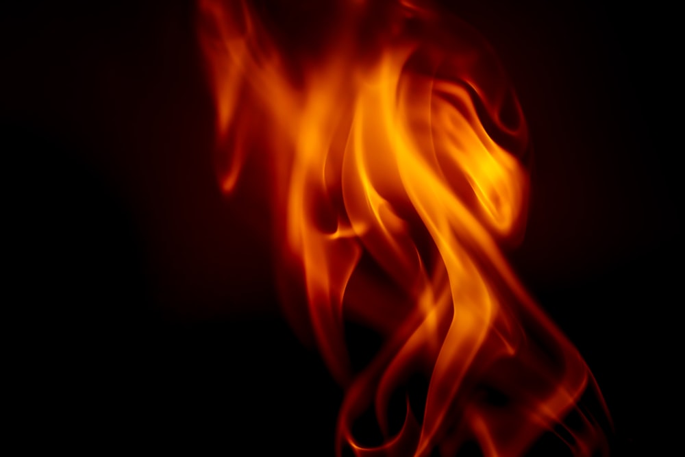 a close up of a fire on a black background