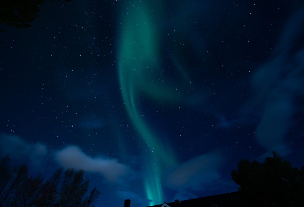 a green aurora bore in the night sky