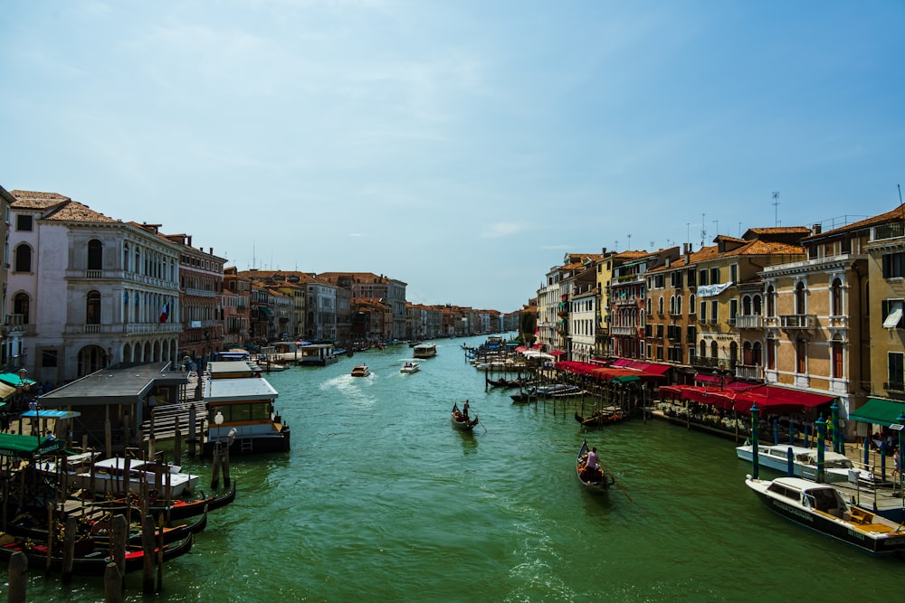 a waterway with boats and buildings on both sides