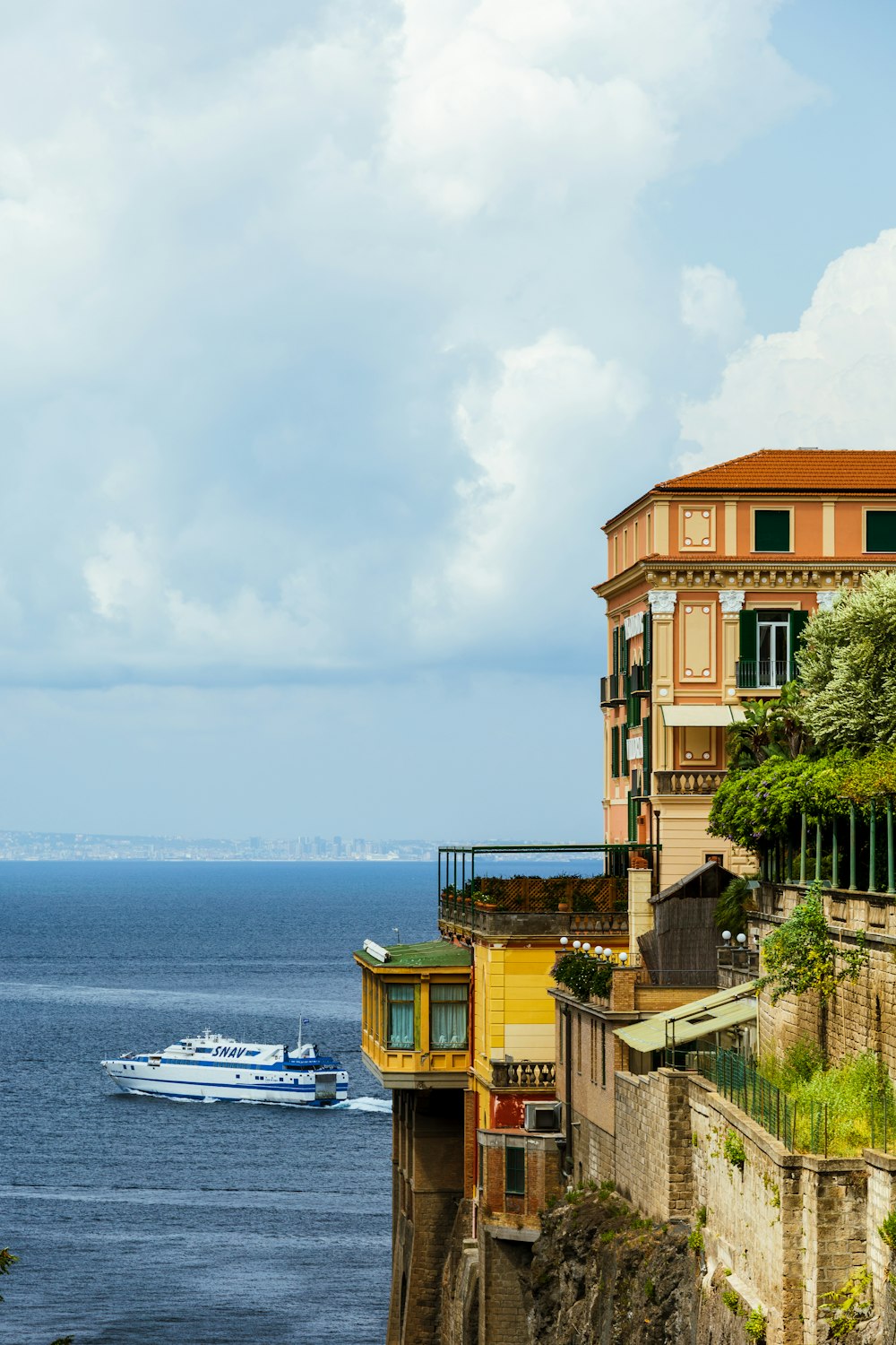 a boat is in the water near a building