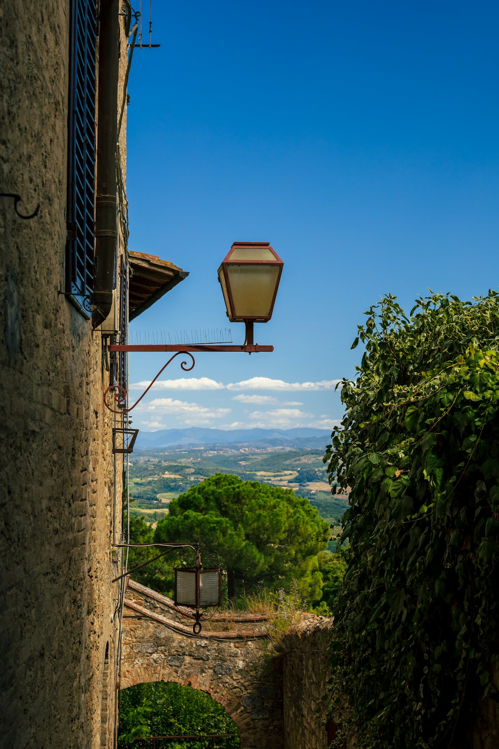 a street light hanging from the side of a building