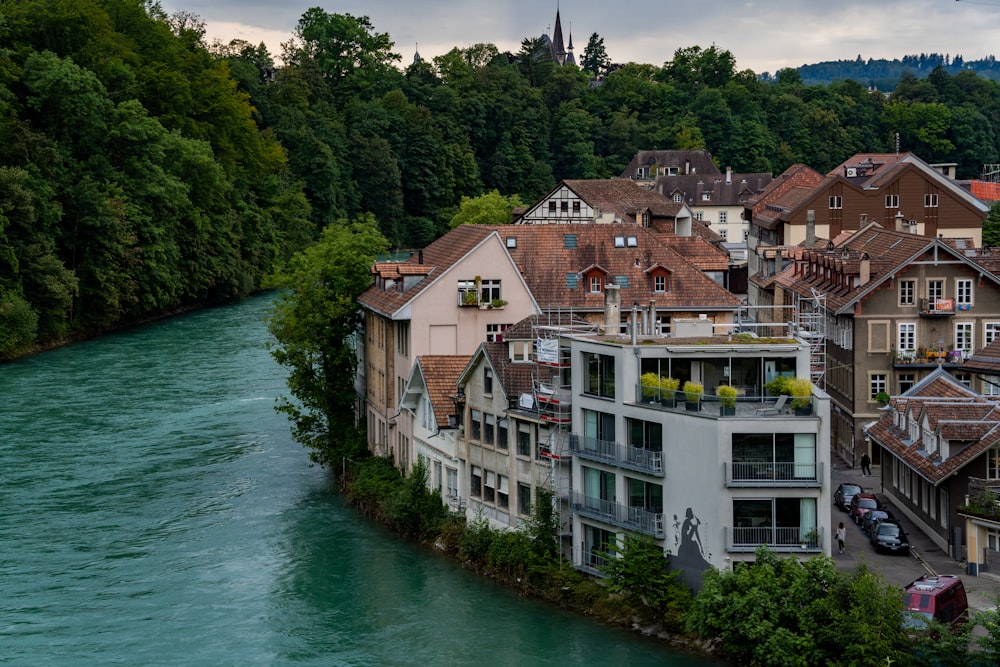 a river running through a city next to tall buildings