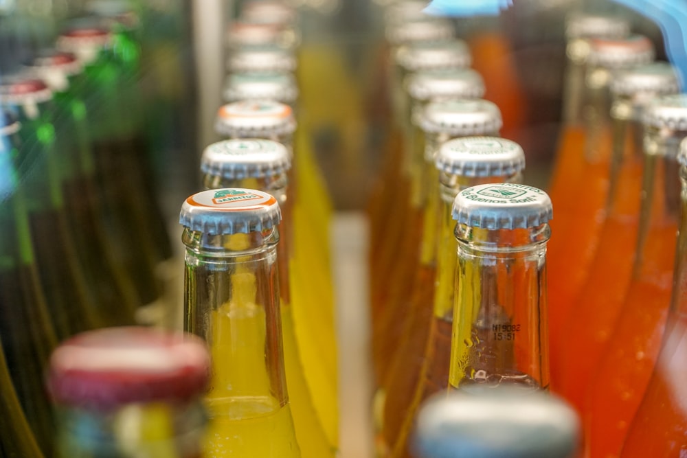 a close up of many bottles of soda