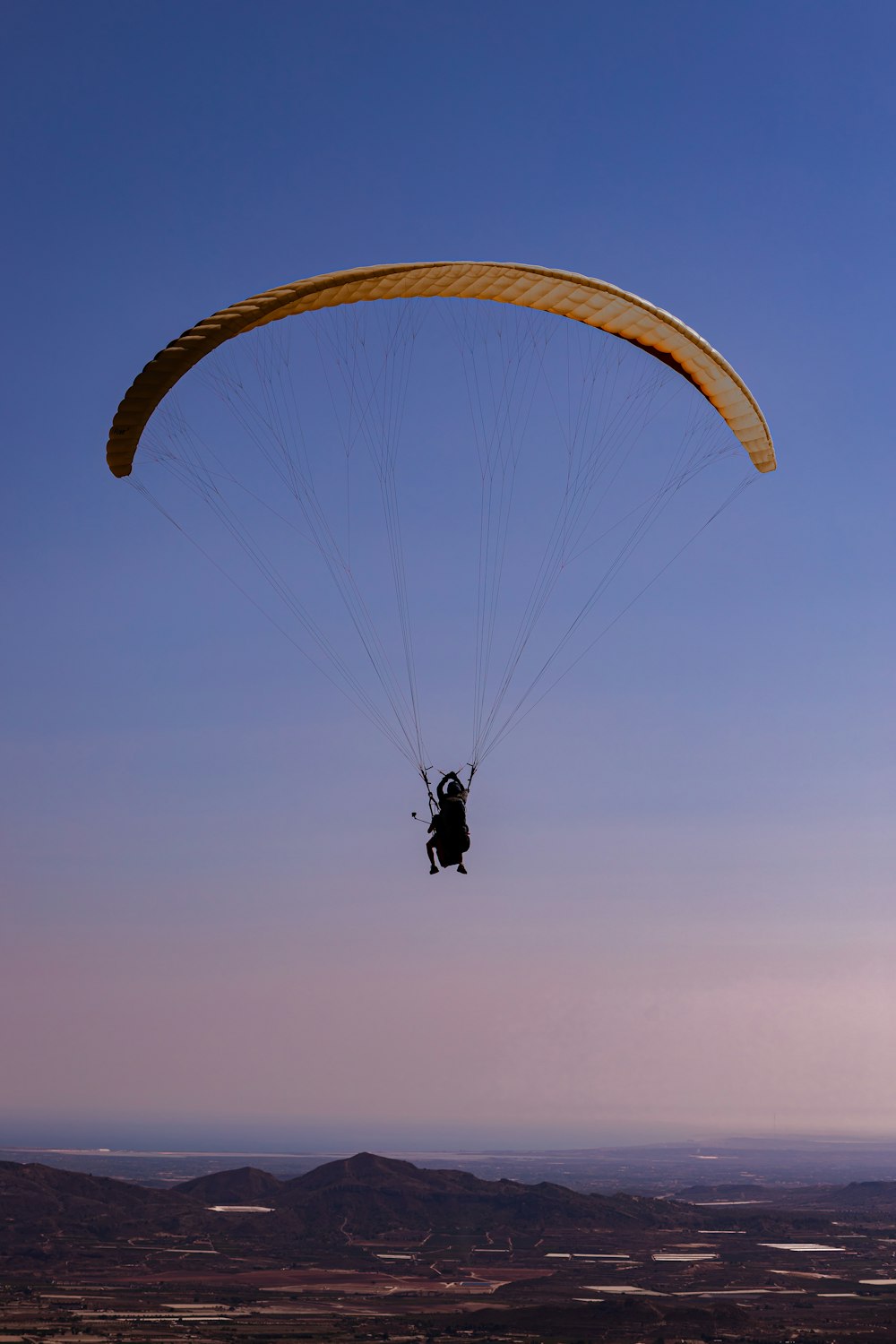 a person is para sailing in the air