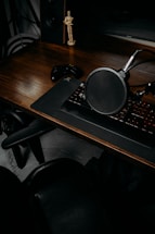 A cozy workspace with game consoles, controllers, and musical instruments neatly arranged, inviting contact.