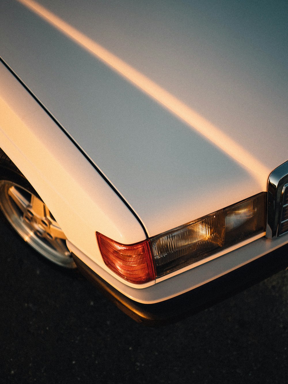 a white car parked on the side of the road