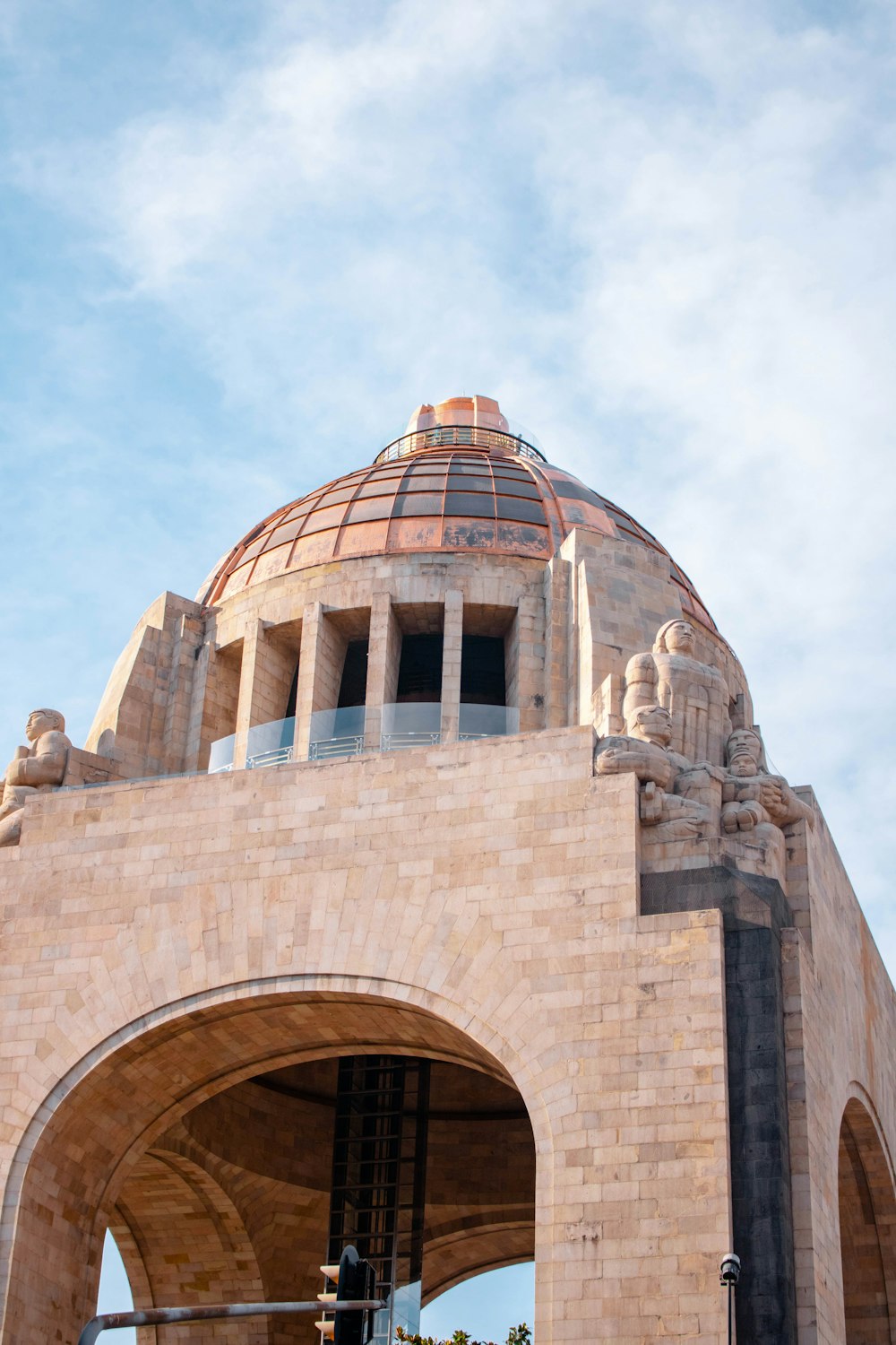 a large stone structure with statues on top of it