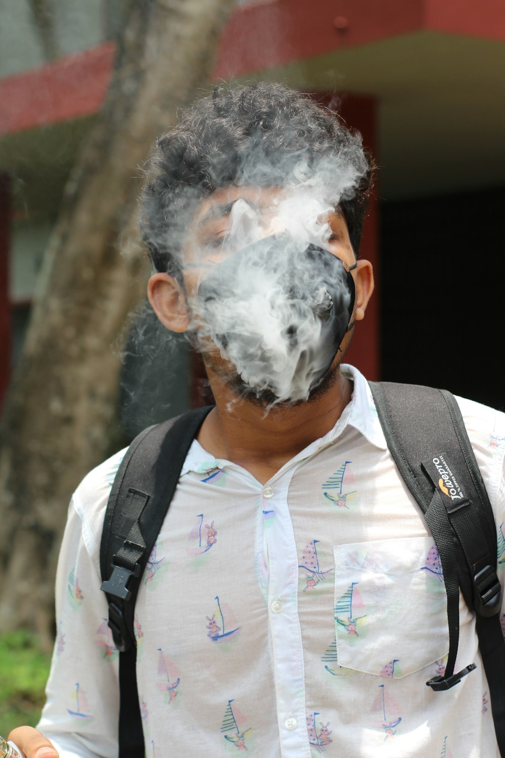 a man with smoke coming out of his mouth