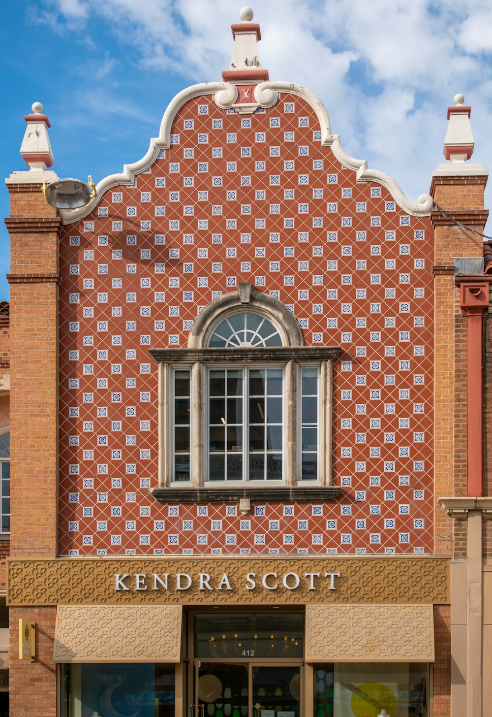 a brick building with a clock on the front of it