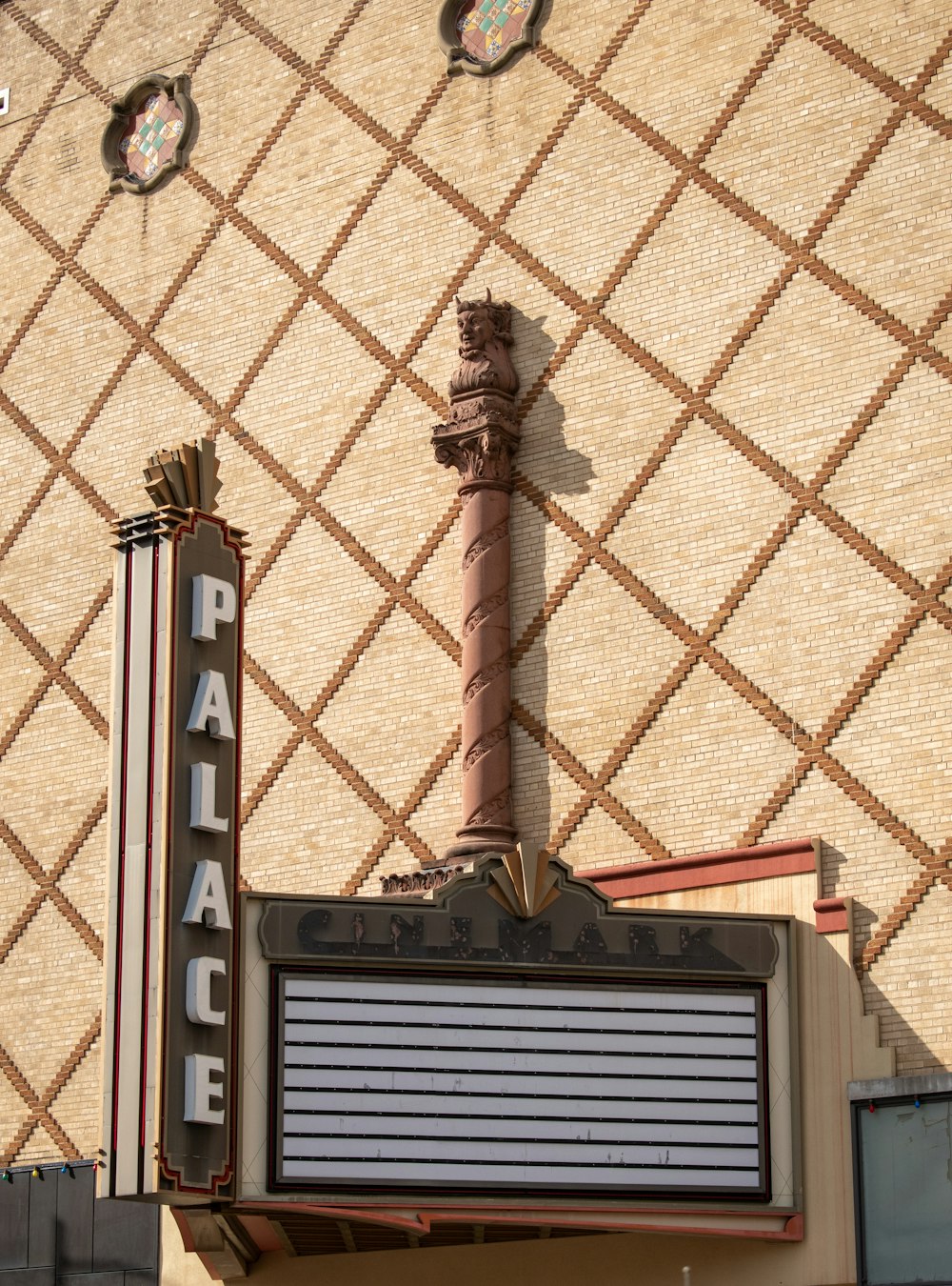 a theater marquee on the side of a building
