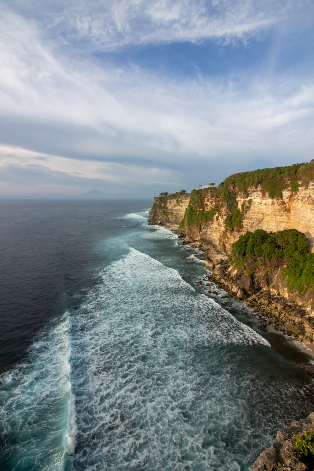 a view of the ocean from the top of a cliff