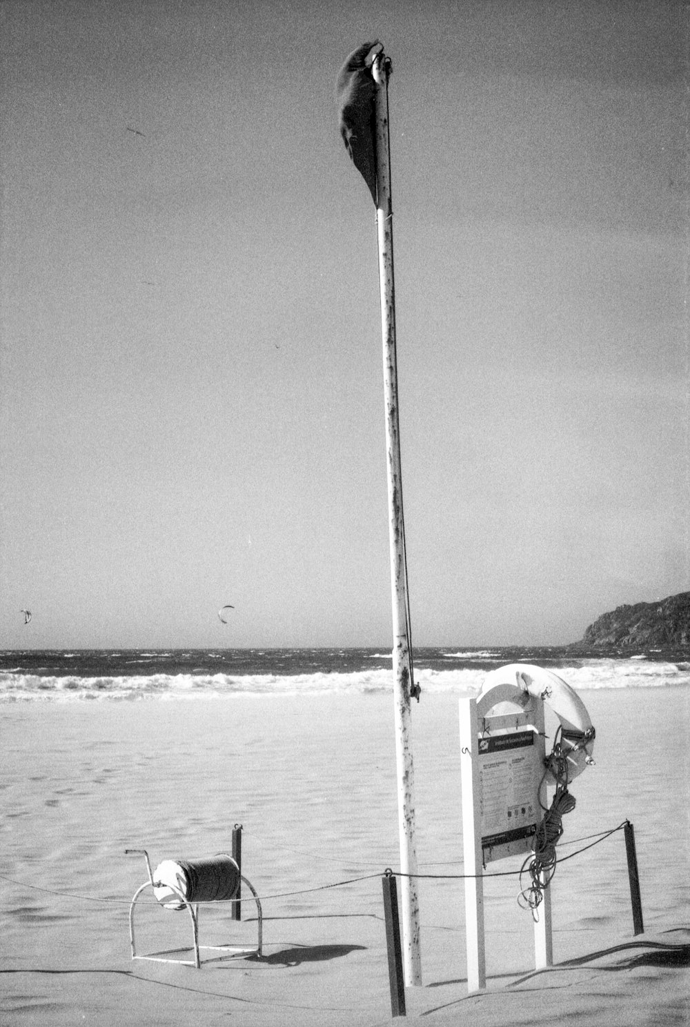 a black and white photo of a beach