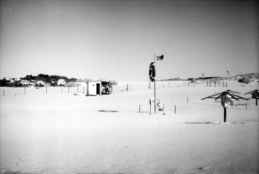 a black and white photo of a snow covered field