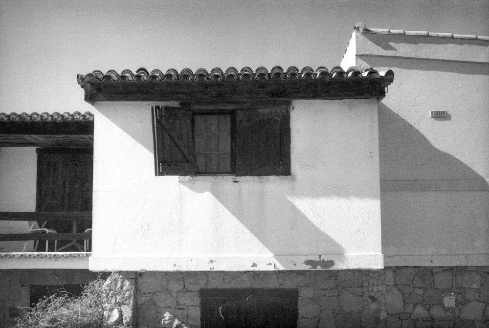 a black and white photo of a house