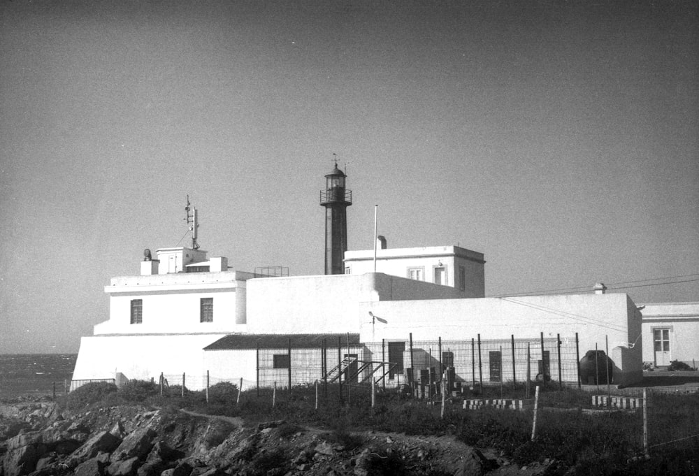 a black and white photo of a lighthouse