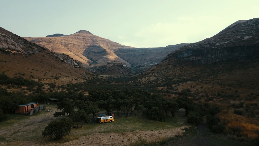 a truck is parked in the middle of a valley