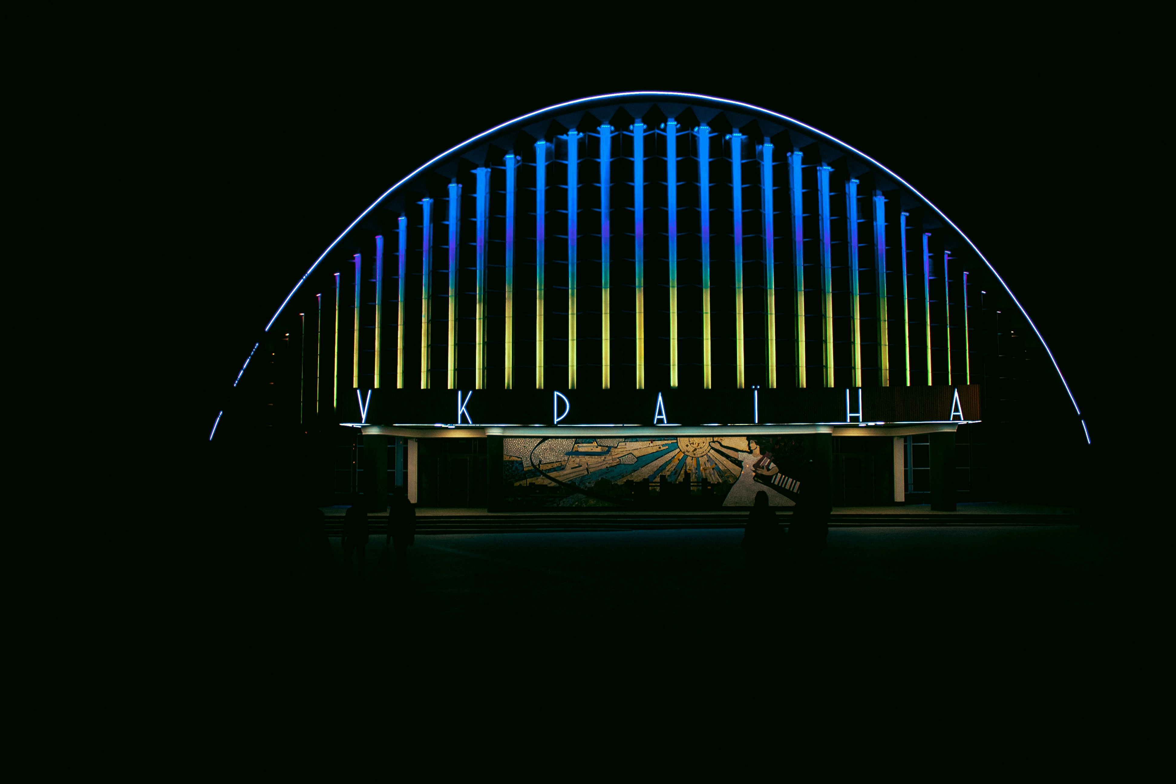 a person standing in front of a large pipe structure