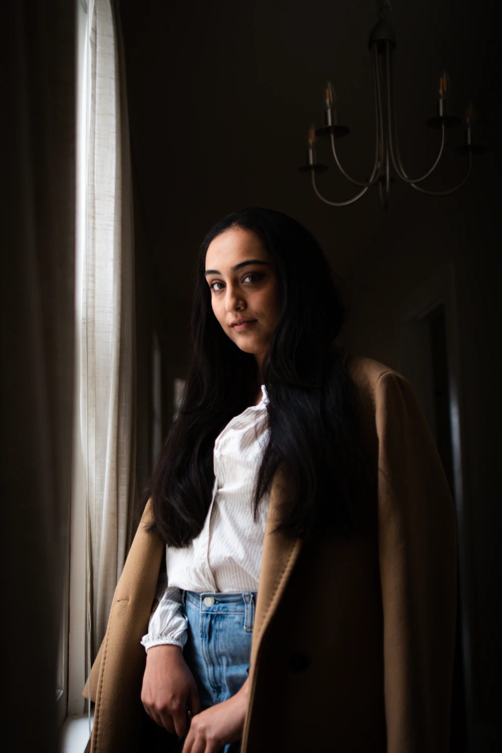 Dr. Elena Marsh standing by the window of her practice