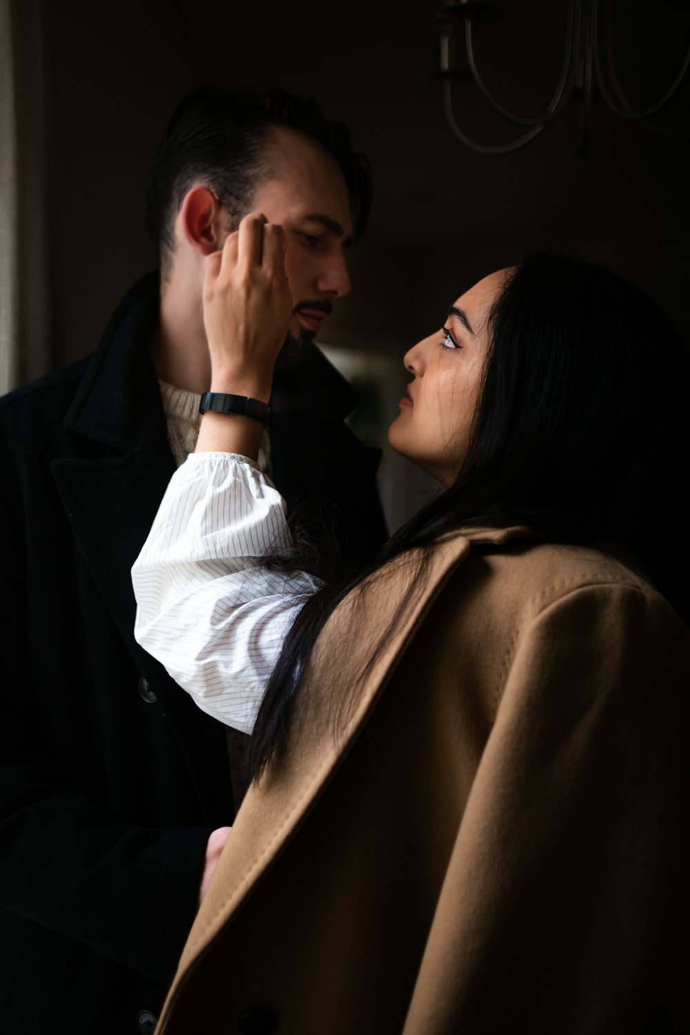 a man and a woman standing next to each other