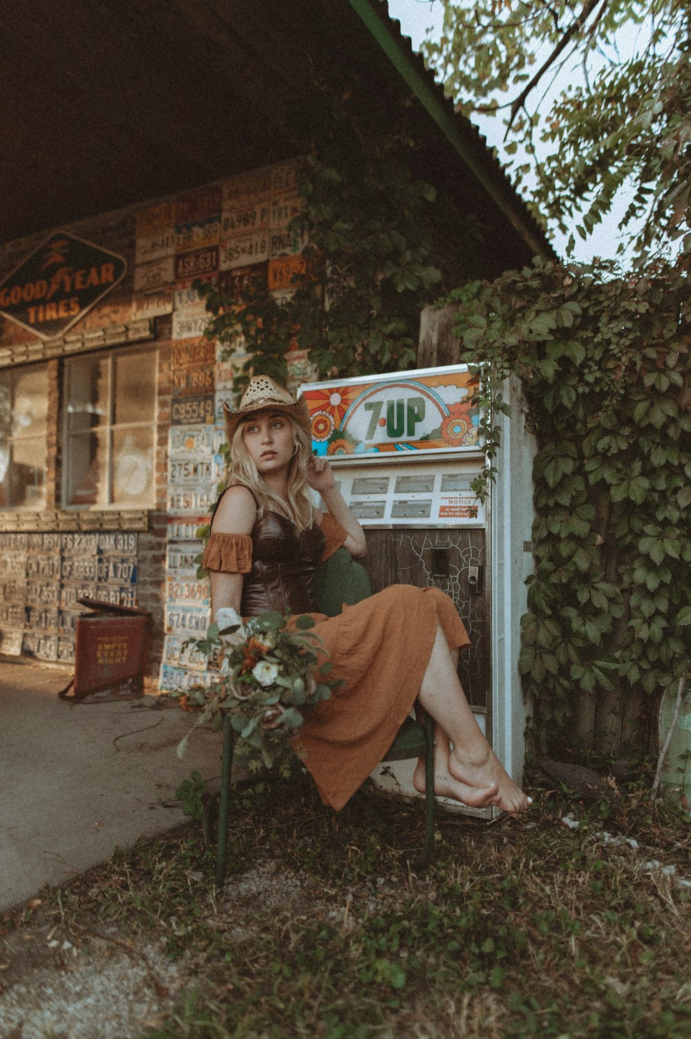 a woman sitting on a chair in front of a vending machine