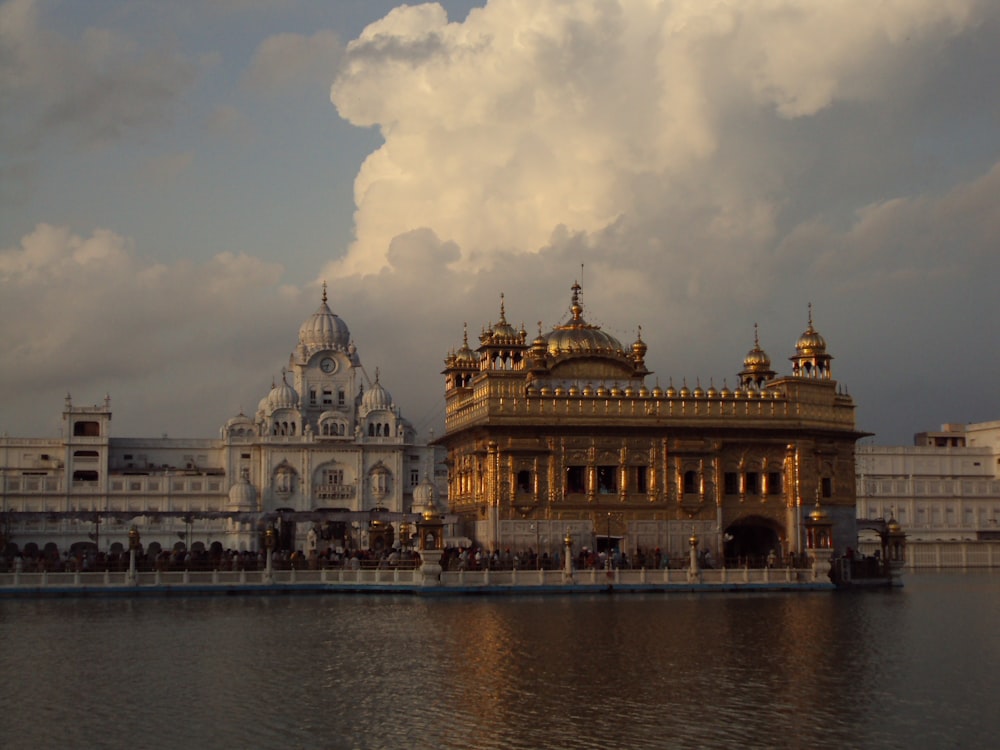 a large body of water with a building in the background