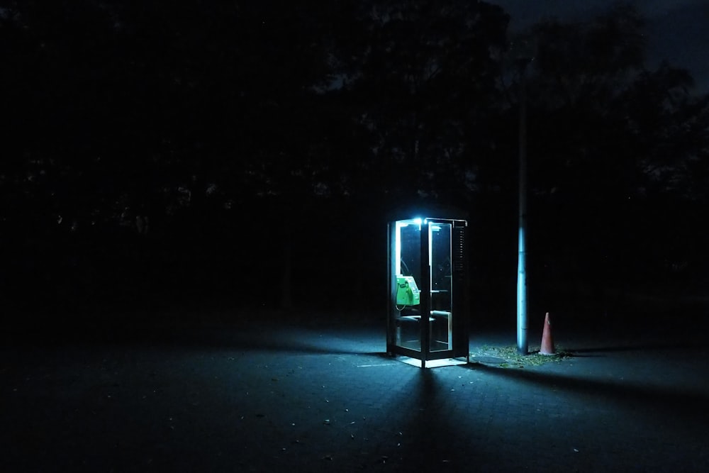 a person standing in a dark area with a light on