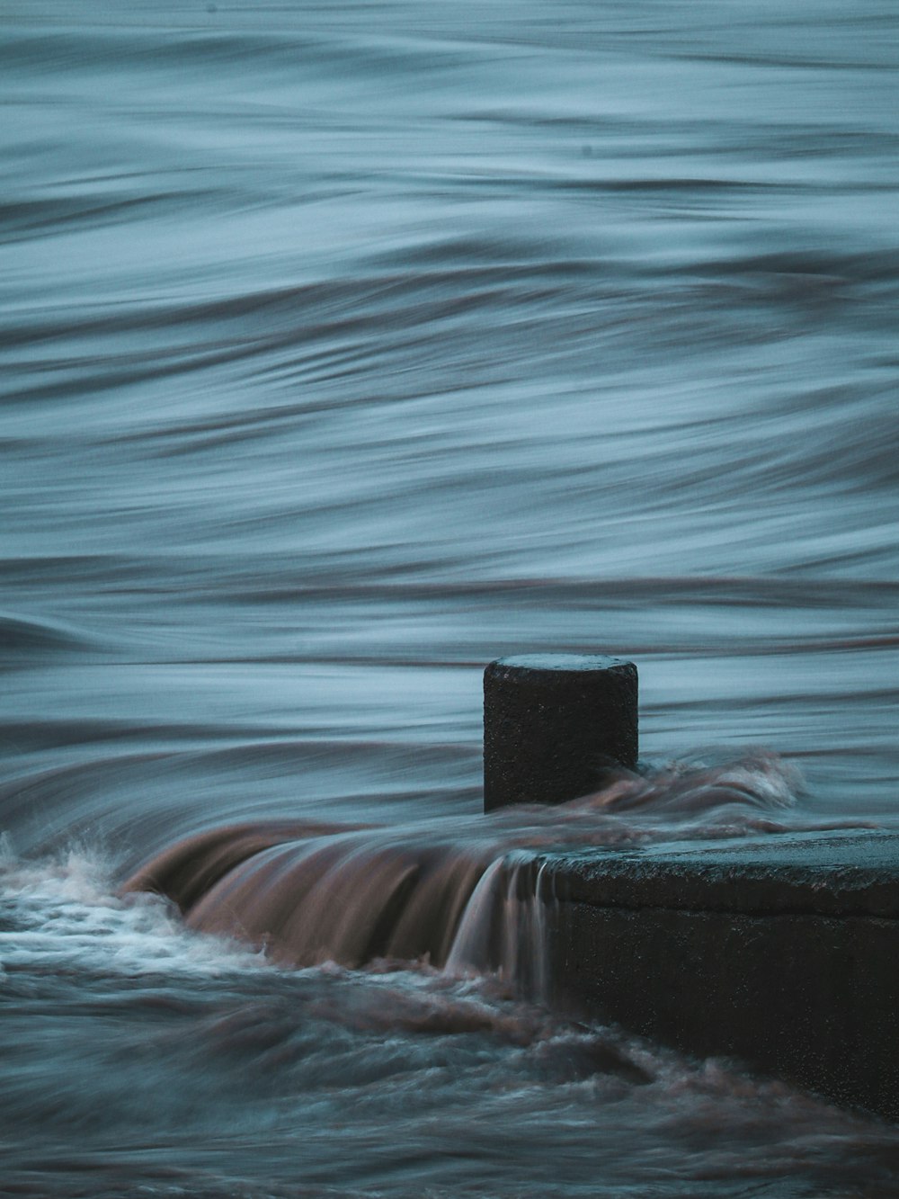 a buoy in the middle of a body of water