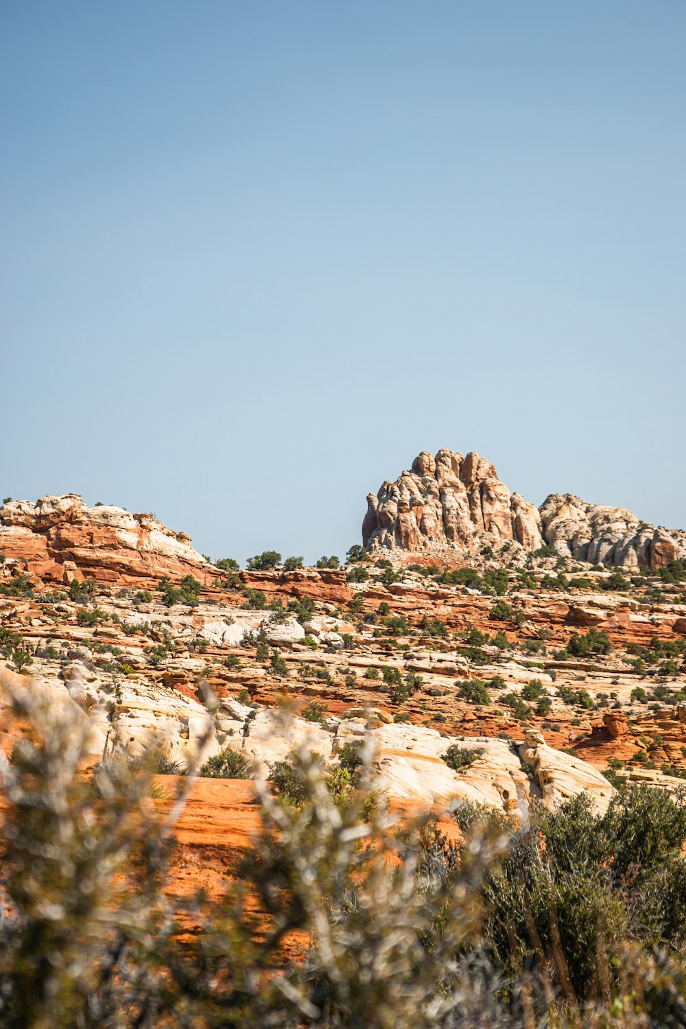 a large rock formation in the middle of a desert