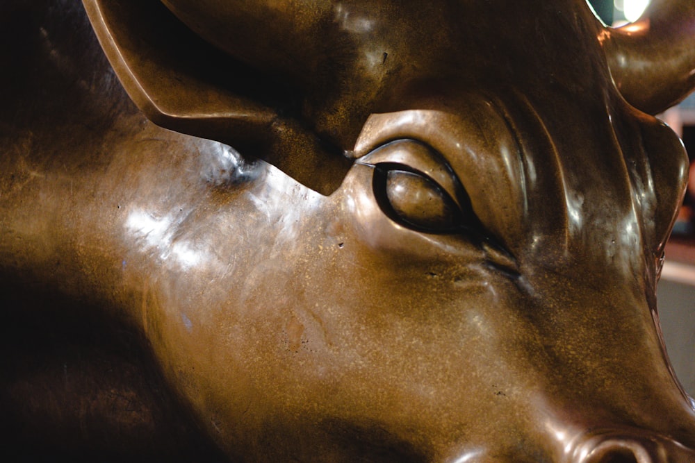 a close up of a statue of a bull