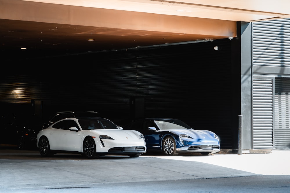 a couple of cars parked in front of a building