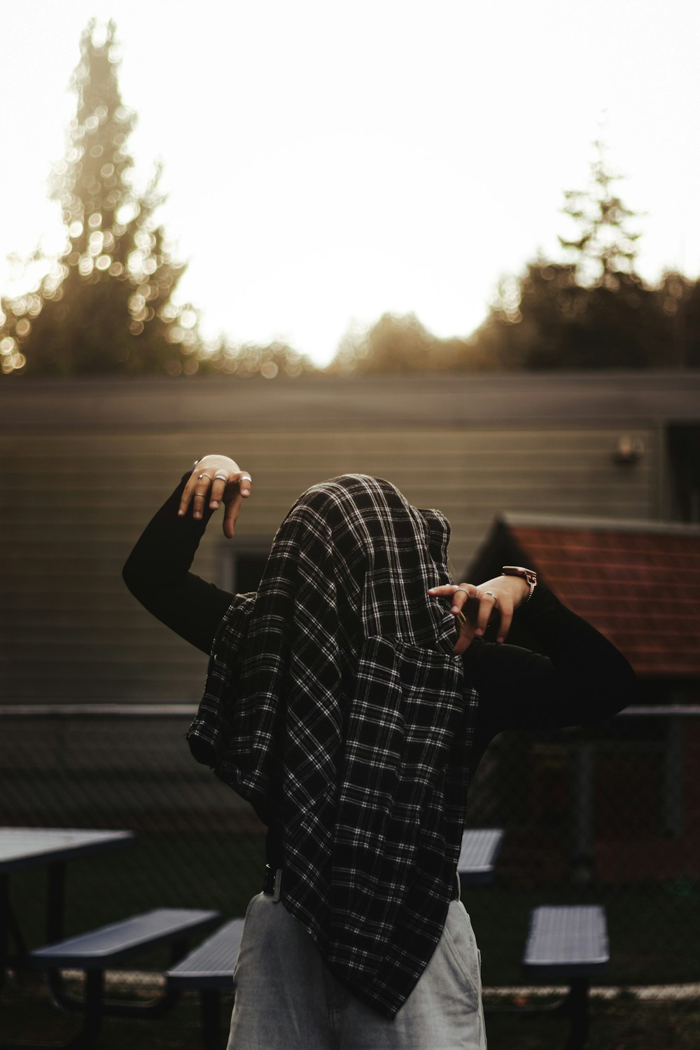 a man standing in front of a picnic table