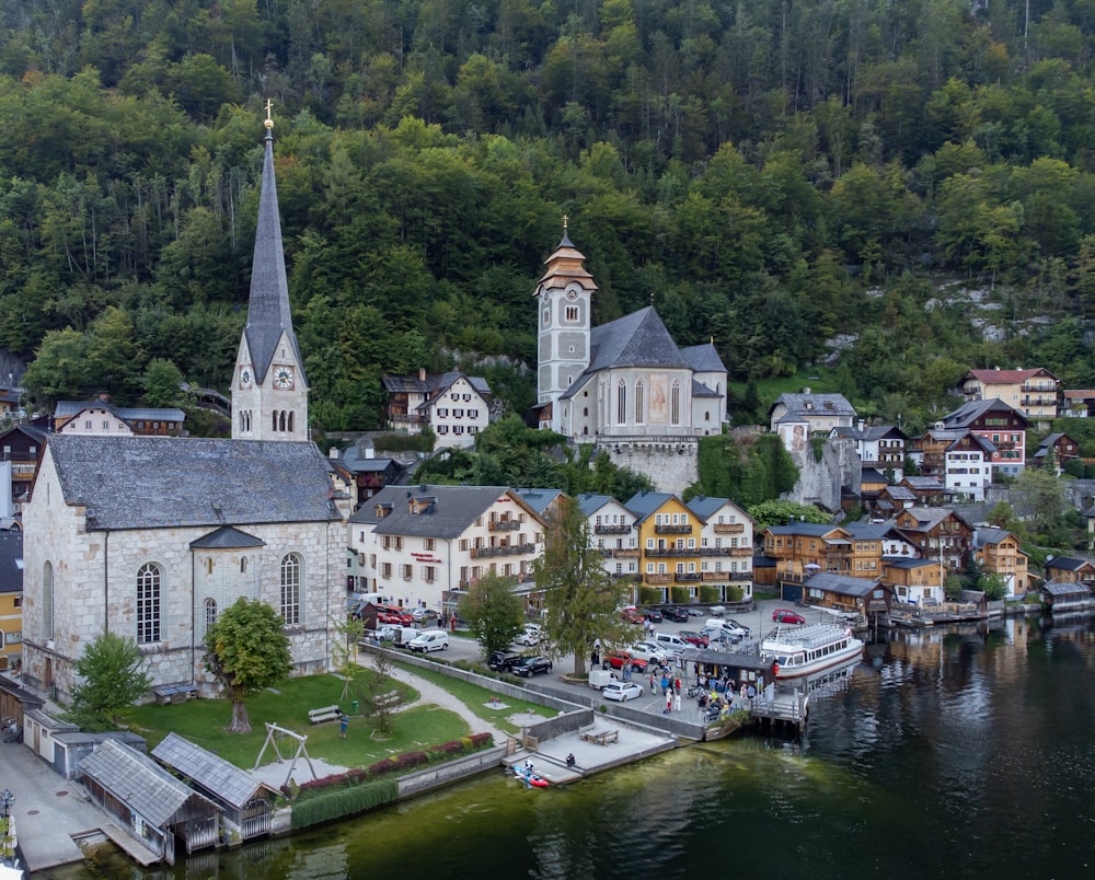 a small village with a church on the shore