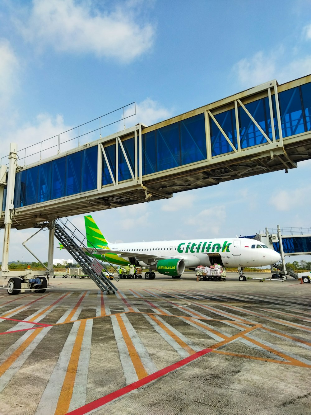 a large jetliner sitting on top of an airport tarmac