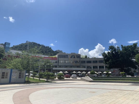 Exterior view of the Á Âu visa development company building on a sunny day.