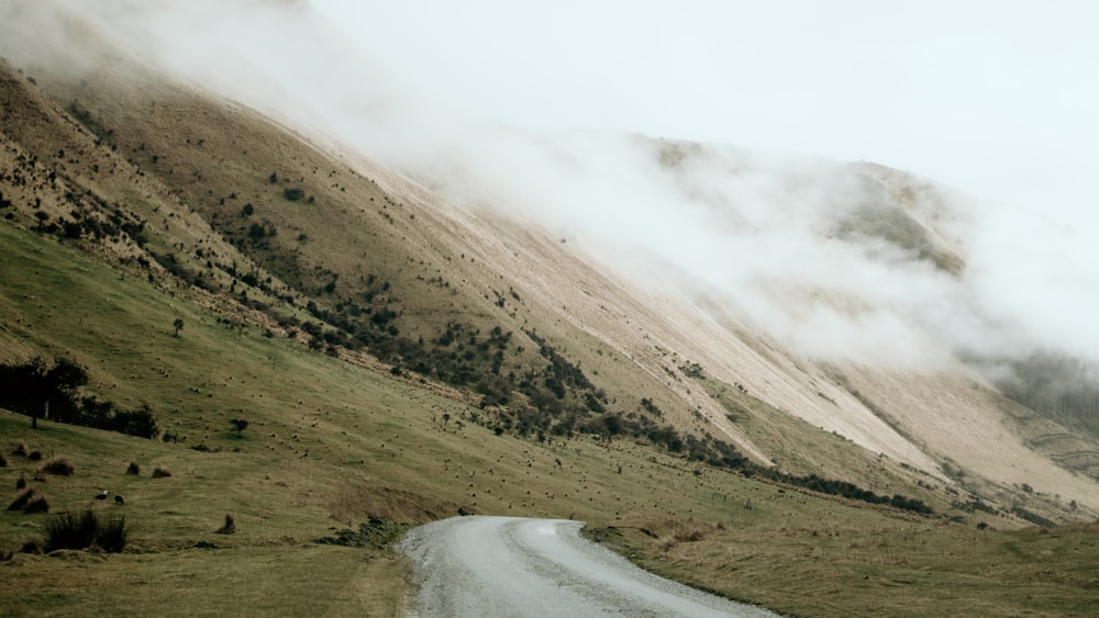 a dirt road in the middle of a mountain range