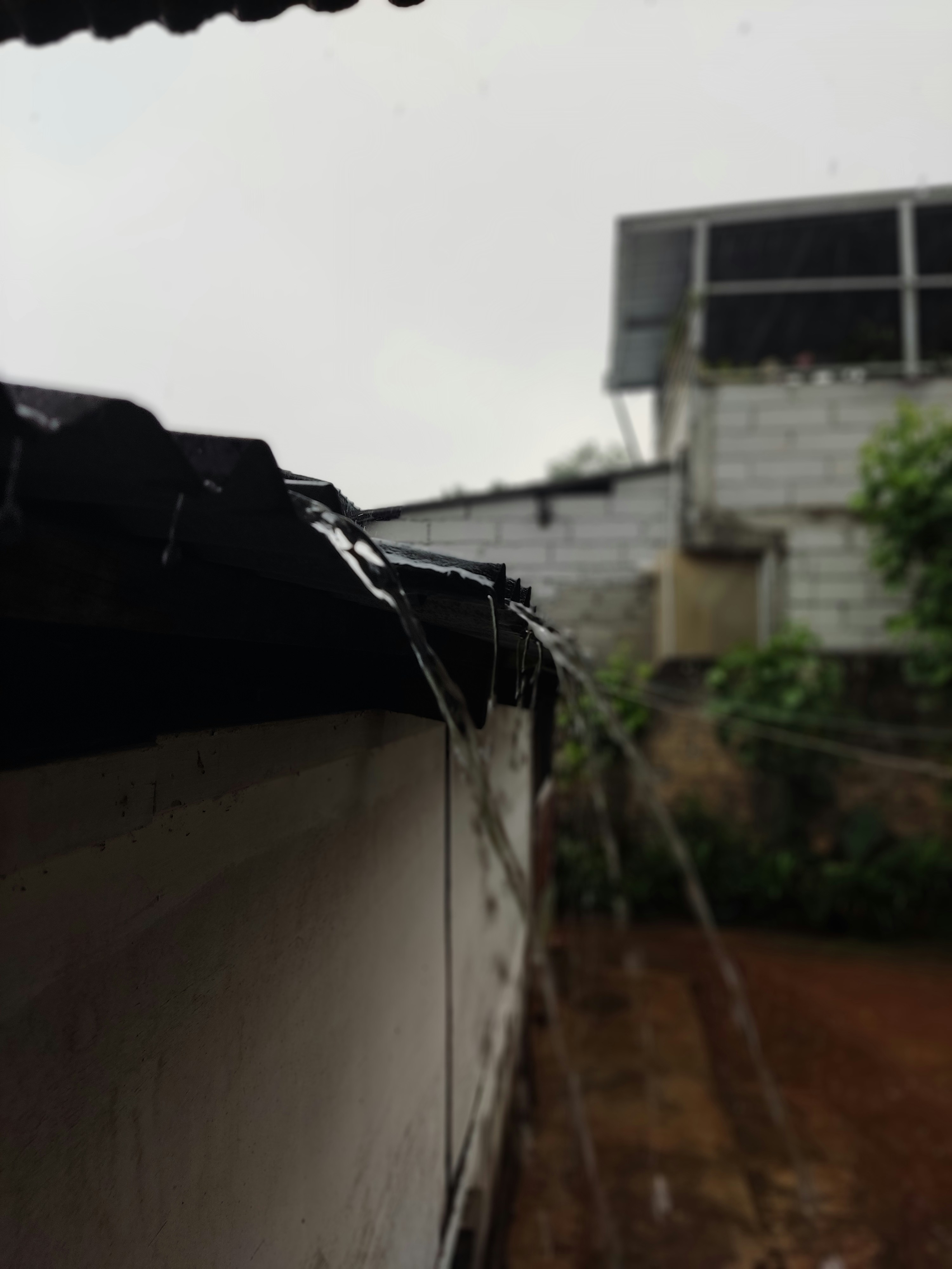 a view of a building from behind a fence