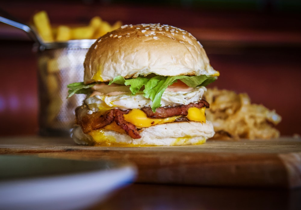 a bacon, egg, and cheese sandwich with a side of potato chips