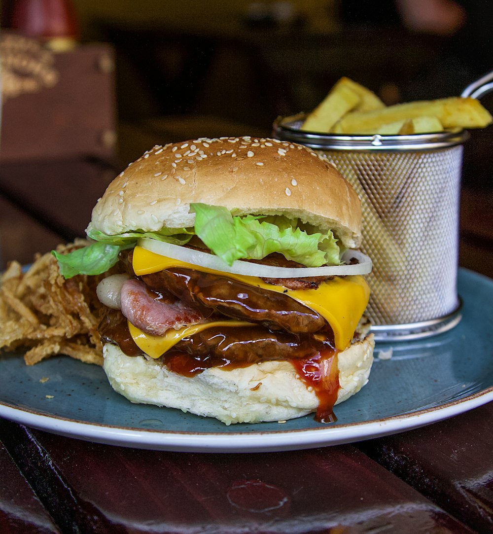 a plate with a hamburger and chips on it