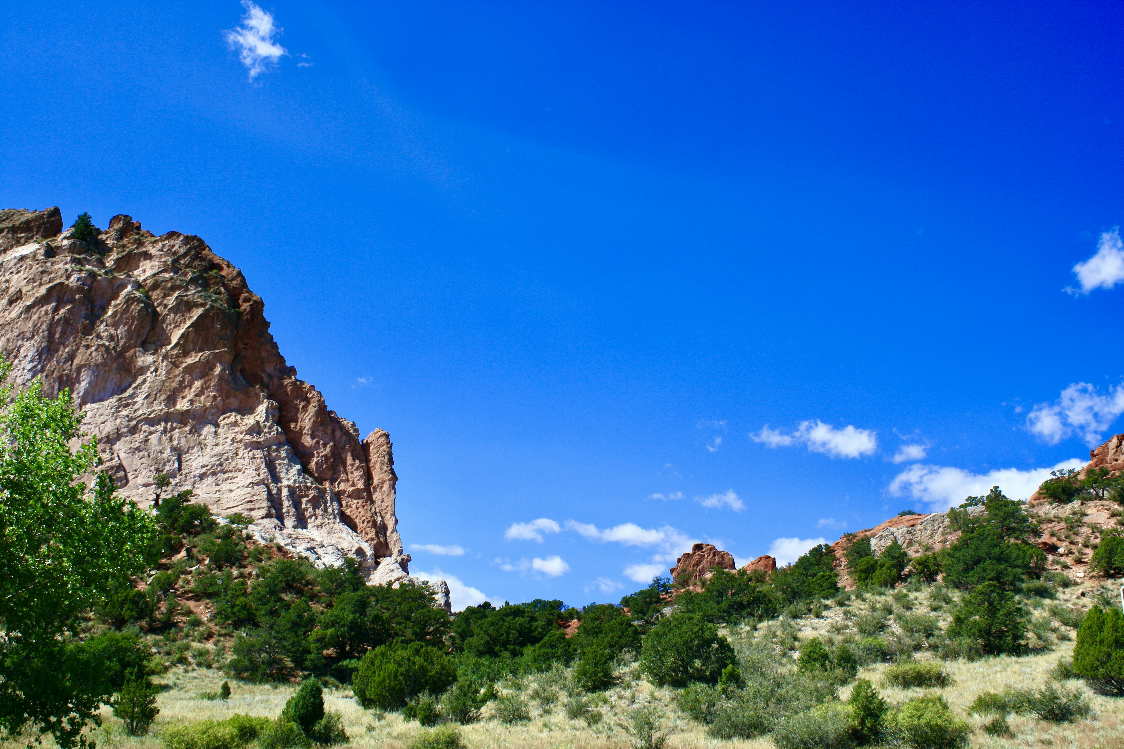 A large rock formation in the middle of a field photo – Free Colorado ...