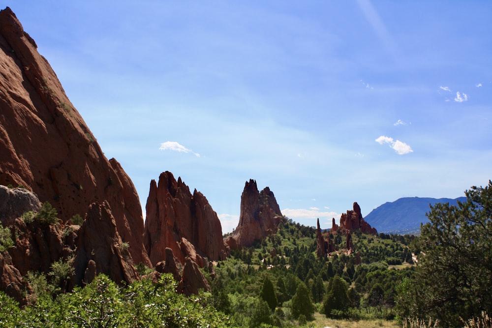 a scenic view of rocks and trees in the desert