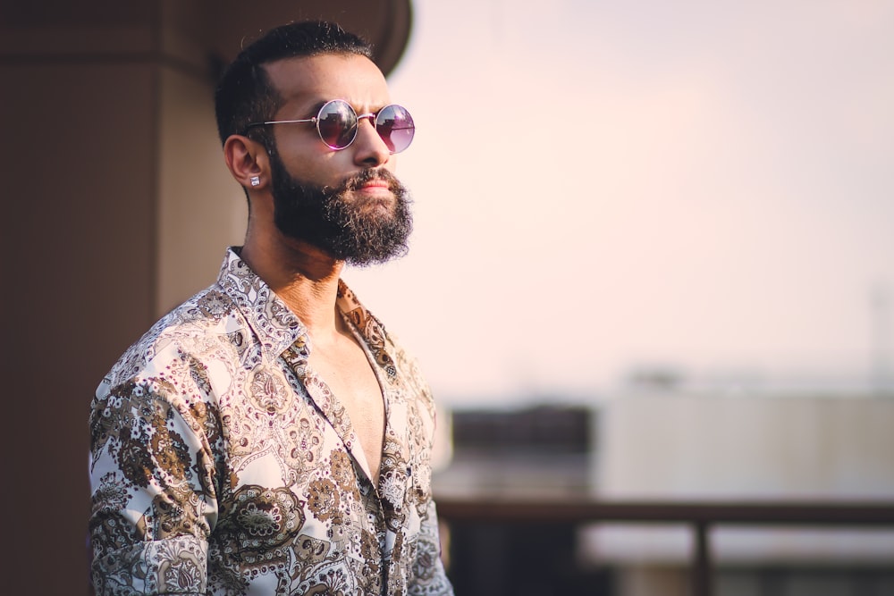 a man with a beard wearing sunglasses