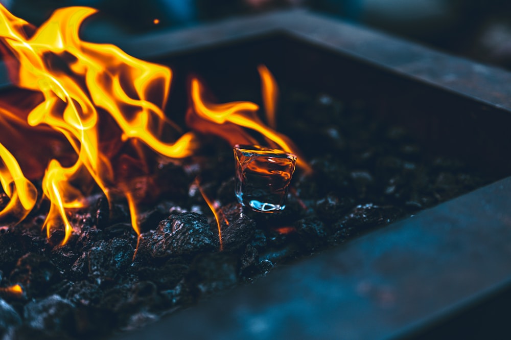 a close up of a fire pit with flames