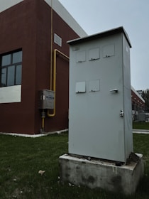 a white box sitting on top of a cement block