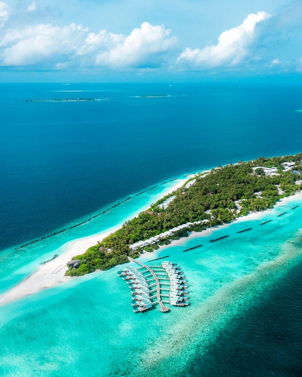 an aerial view of a small island in the middle of the ocean