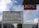 A multilingual sign indicating a border between sectors is displayed prominently in front of a modern urban backdrop. Next to it is a KFC sign. The sky is partly cloudy, and several buildings are visible in the background.