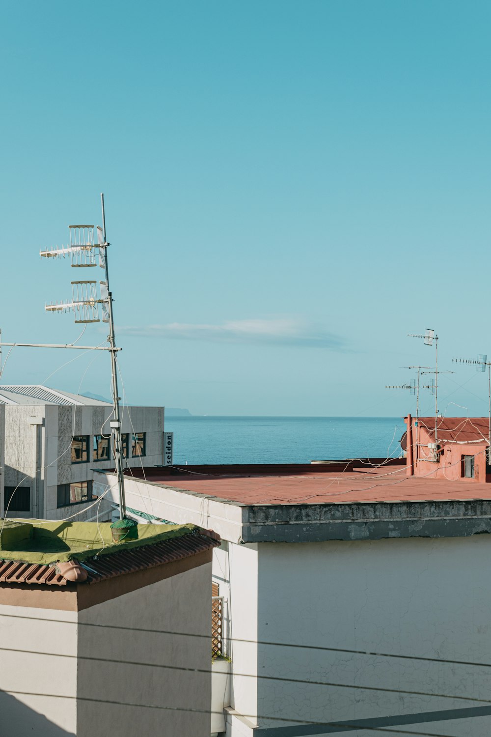 a view of the ocean from the roof of a building