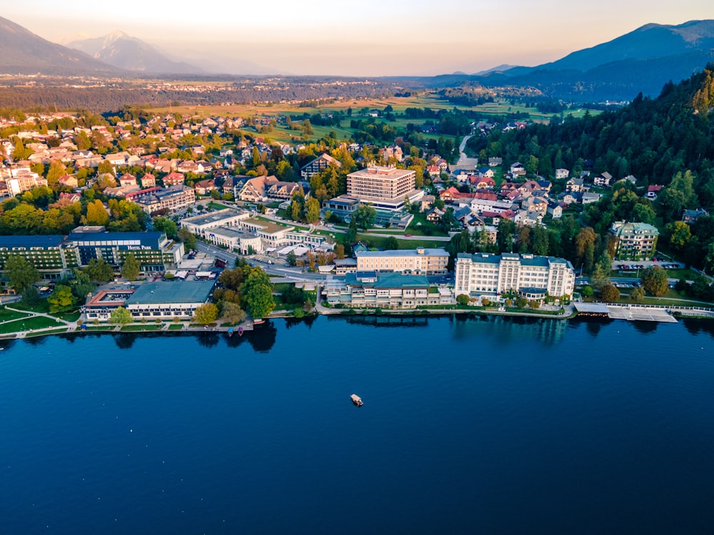 an aerial view of a city on a lake